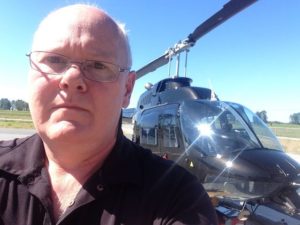 Mr. Locksmith Automotive Randy Bath Repairing the locks on a Bell Helicopter.