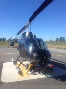 Repairing the compartment locks on a Bell Helicopter.